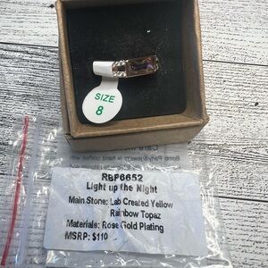 Yellow rainbow topaz on rose gold ring